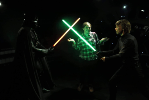 Vyara with mannequins of Luke Skywalker and Darth Vader having a lightsaber duel