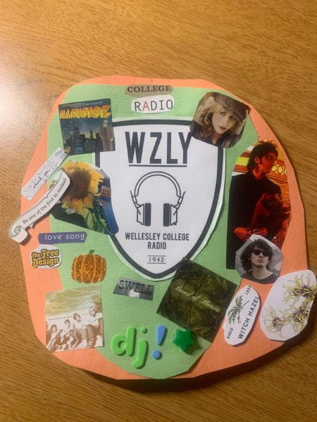 Door tag made of construction paper decorated with images of musicians and the WZLY logo