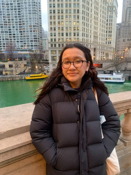 Image of Tenzin standing in front of the river in Chicago.