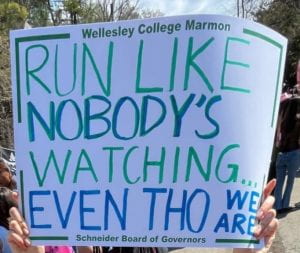 Sign reading "Run like nobody's watching even tho we are"
