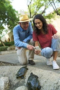 Stathatos with her advisor, Pietro Perona, using the inaturalist app, which uses some of Perona's computer vision work, to ID turtle species at CalTech.