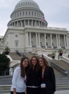 Three girls in front of the capital building